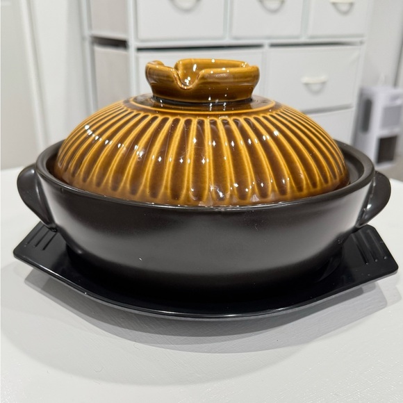 Other - Japanese ceramic pot with lid and handle for cooking in the kitchen.